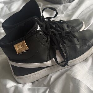 Nike Black and White Sneakers with Gold Accent